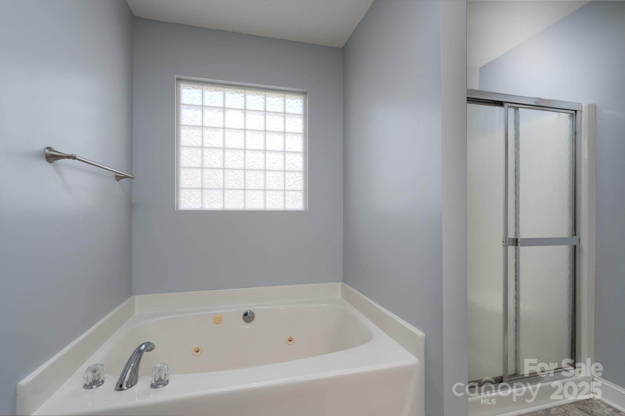 280 Bonaventure Drive Salisbury, NC 28147 - Photo 17 of 48 a white bath tub sitting next to a window