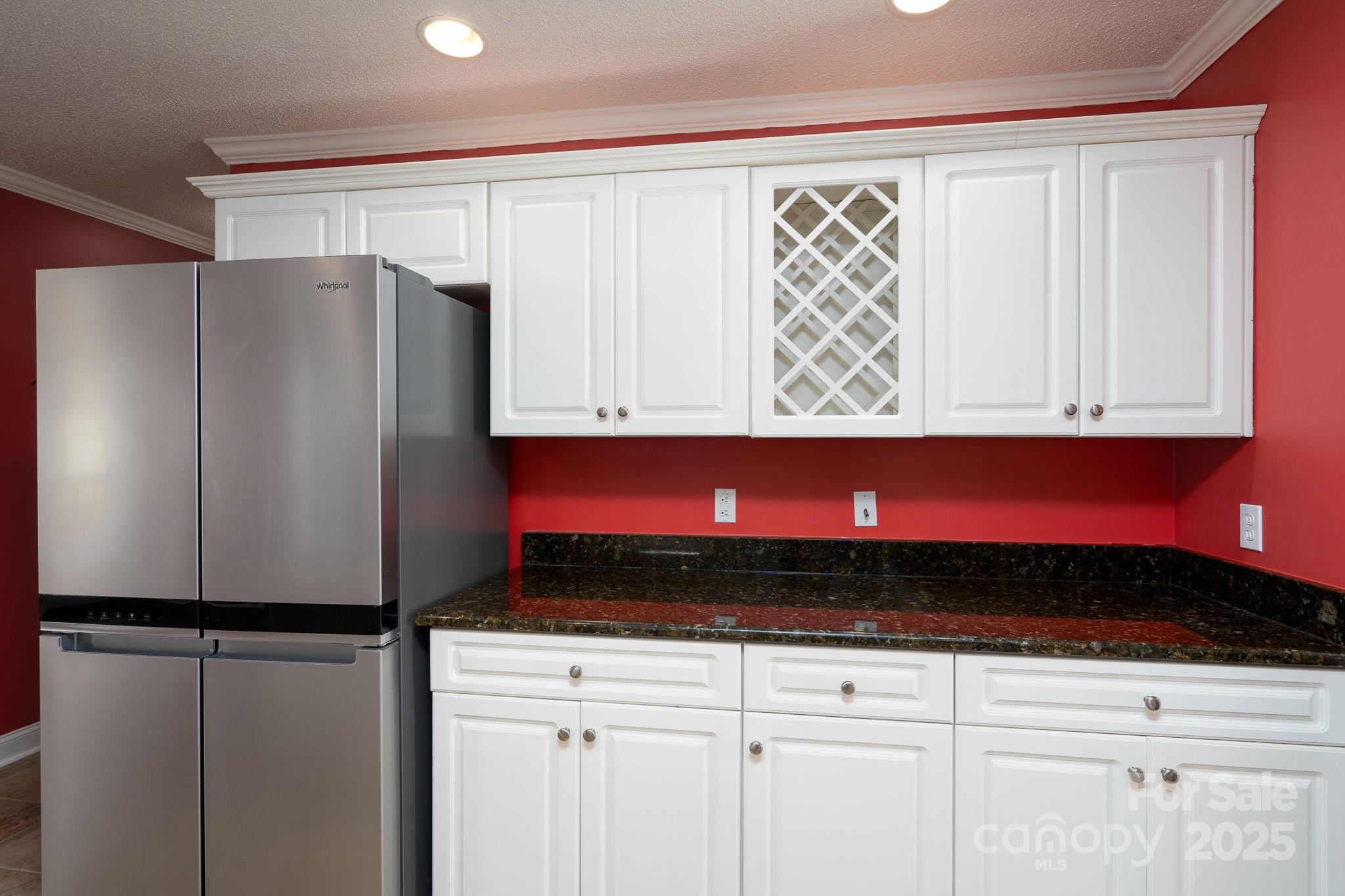 280 Bonaventure Drive Salisbury, NC 28147 - Photo 30 of 48 a kitchen with a refrigerator and cabinets