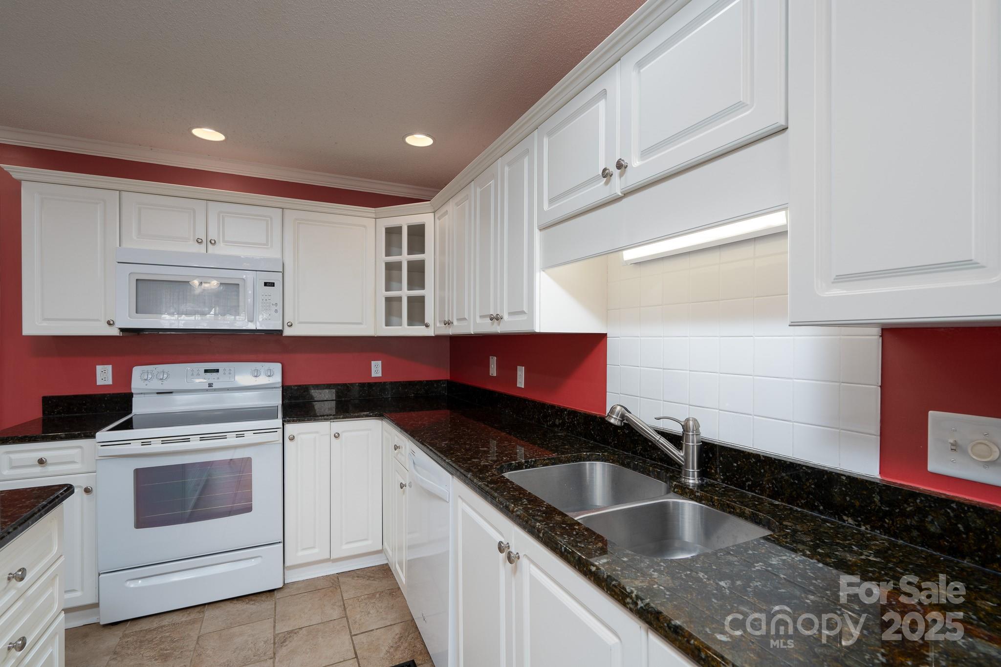 280 Bonaventure Drive Salisbury, NC 28147 - Photo 31 of 48 a kitchen that has a sink and a stove
