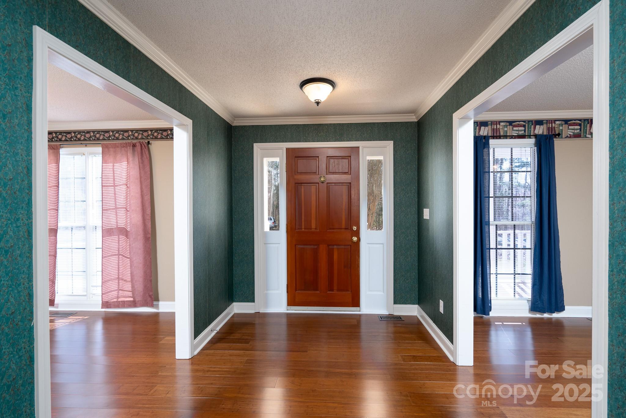 280 Bonaventure Drive Salisbury, NC 28147 - Photo 36 of 48 a view of a hallway with wooden floor and windows