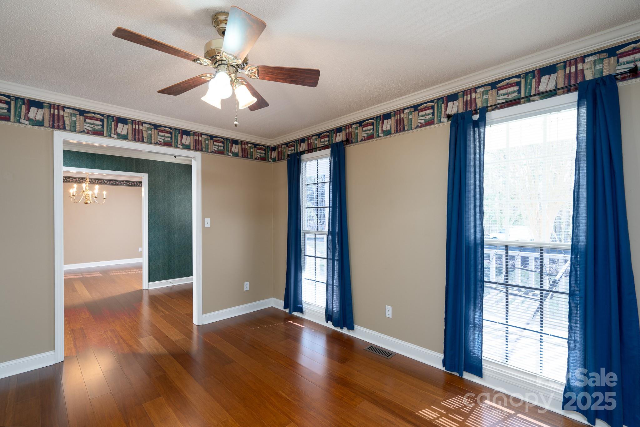 280 Bonaventure Drive Salisbury, NC 28147 - Photo 38 of 48 a view of an empty room with wooden floor and a window