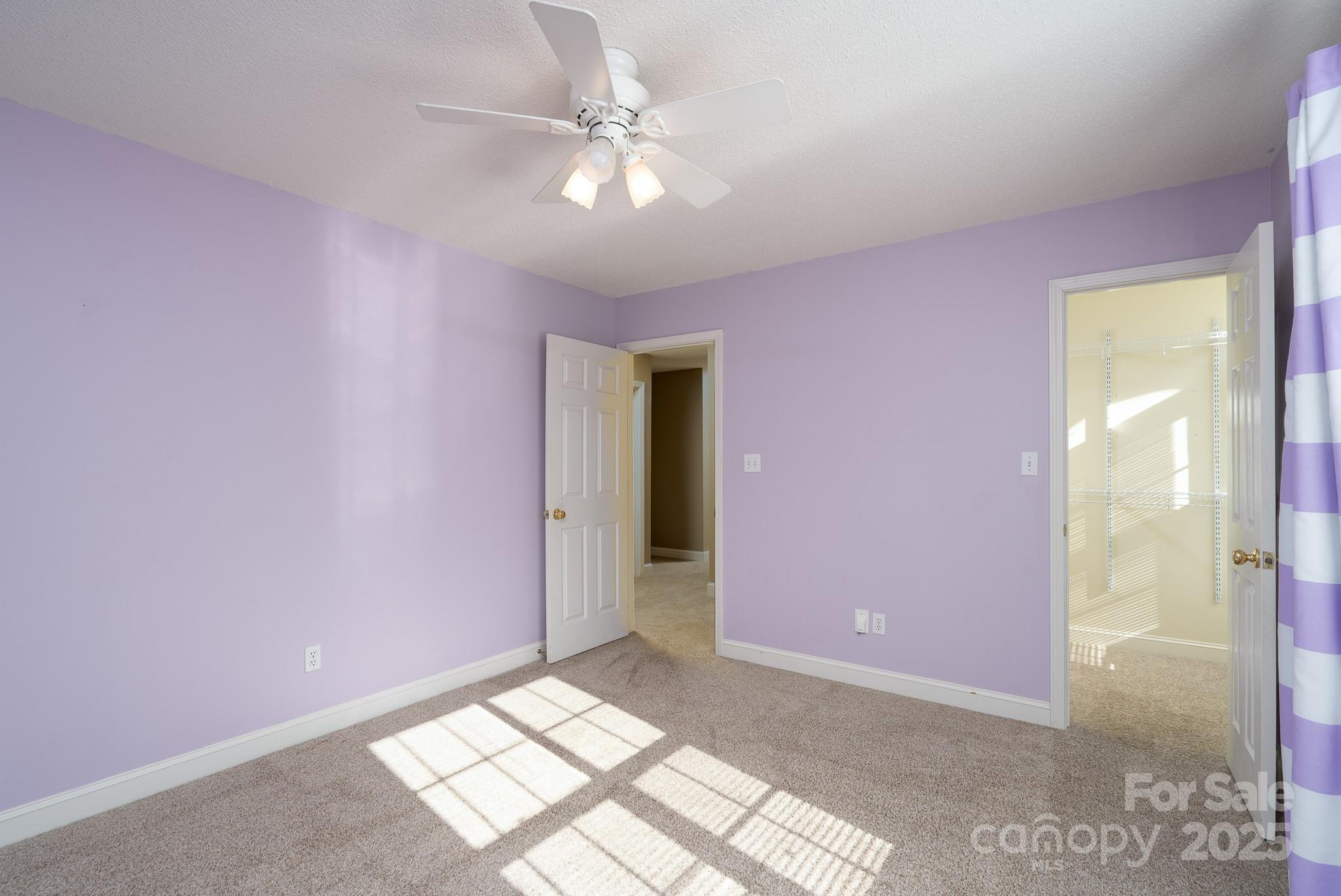 280 Bonaventure Drive Salisbury, NC 28147 - Photo 9 of 48 a view of an empty room with window and chandelier fan