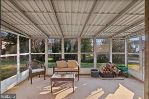 a garden view with a sitting space and glass windows