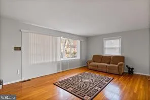 a living room with furniture and a rug