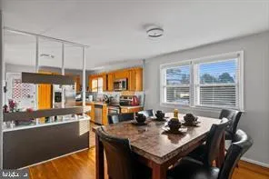 a view of a kitchen with a table and chairs