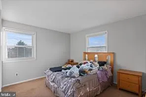 a bed room with a bed and a window