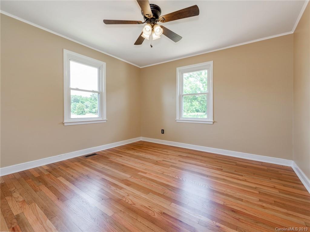 1084 Memorial Park Road Lancaster, SC 29720 - Photo 14 of 24 a view of an empty room with wooden floor and a window