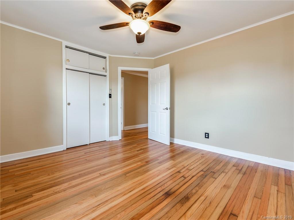 1084 Memorial Park Road Lancaster, SC 29720 - Photo 17 of 24 an empty room with wooden floor a ceiling fan and closet area