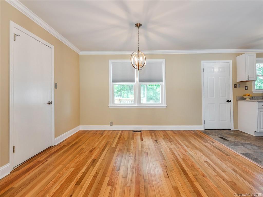 1084 Memorial Park Road Lancaster, SC 29720 - Photo 6 of 24 a view of empty room with wooden floor and fan
