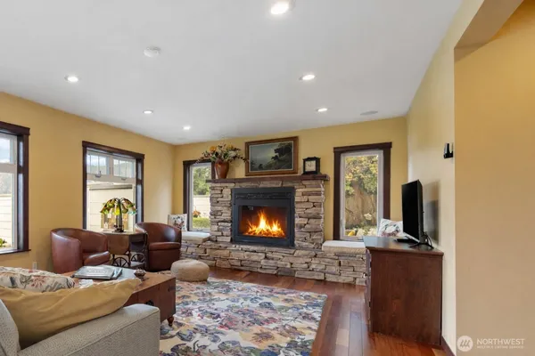 a living room with furniture and a fireplace