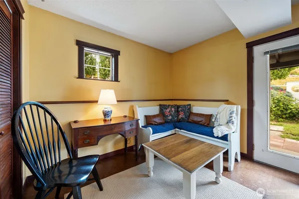 a living room with furniture and a window