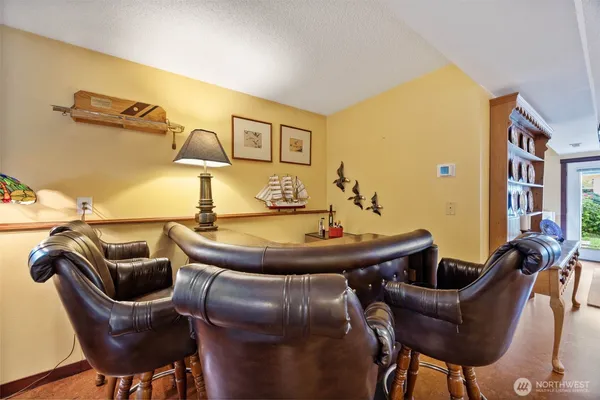 a room with furniture and gym equipment