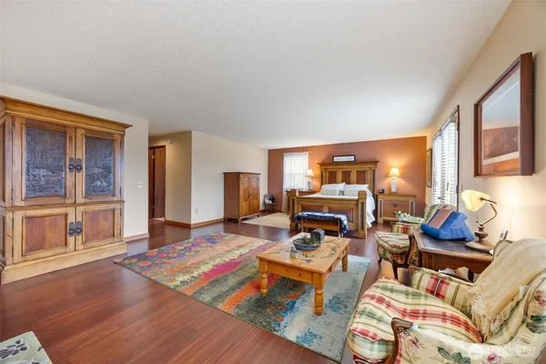 a living room with furniture and large windows