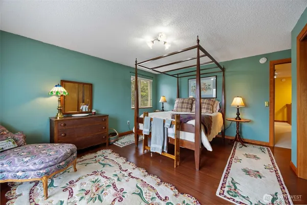 a bedroom with furniture and a bed