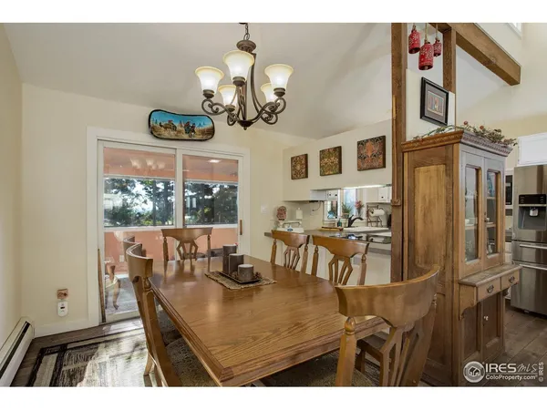a kitchen with a table chairs and living room