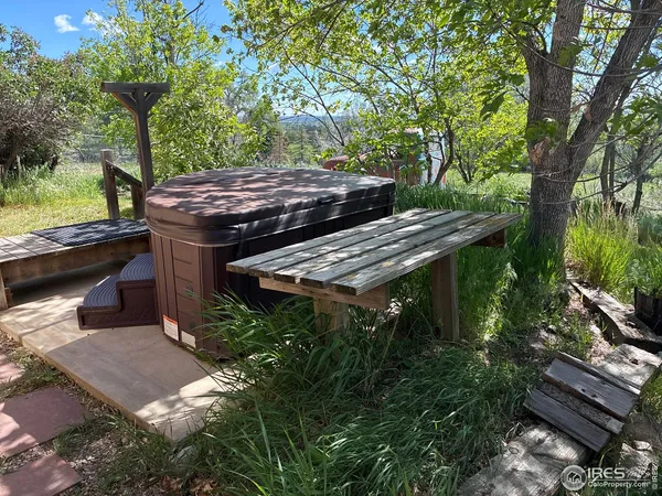 a view of a house with backyard porch and sitting area