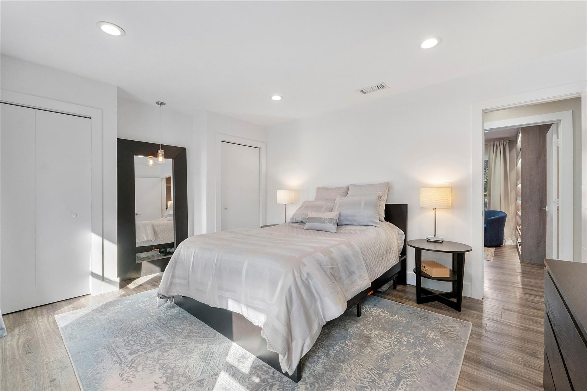 5351 Godfrey Road Parkland, FL 33067 - Photo 26 of 95 a bedroom with a bed and a lamp