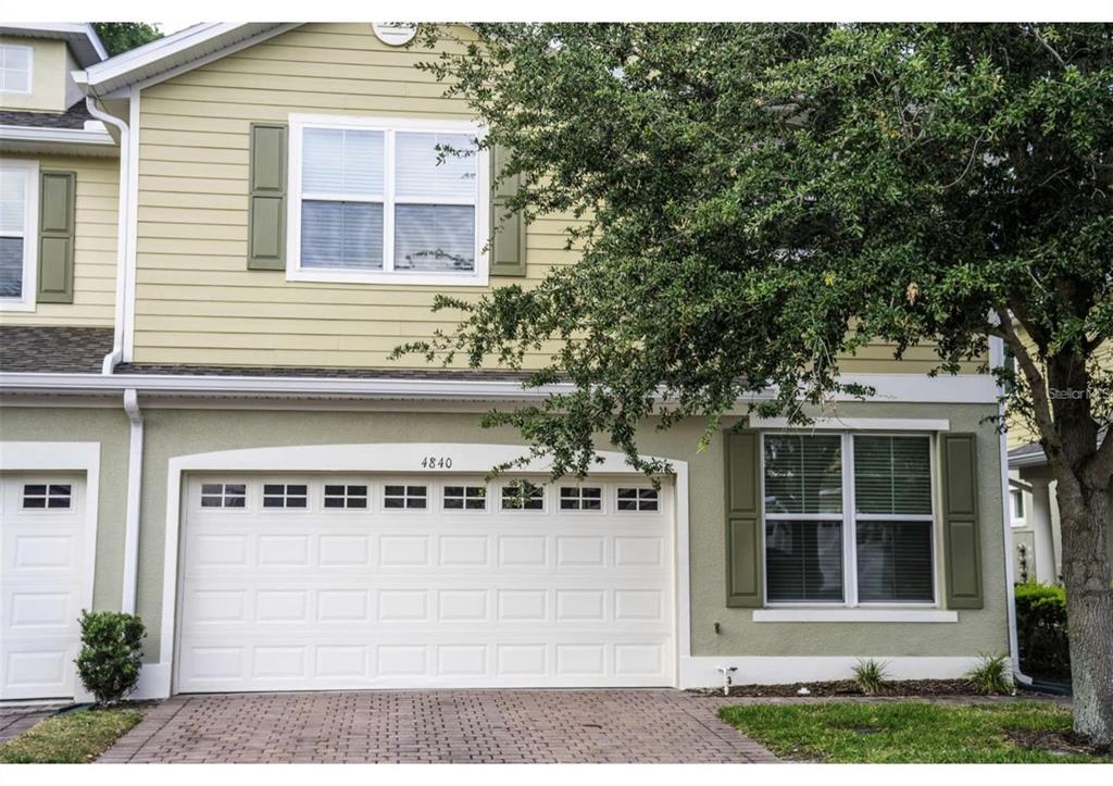 a front view of a house with a garage