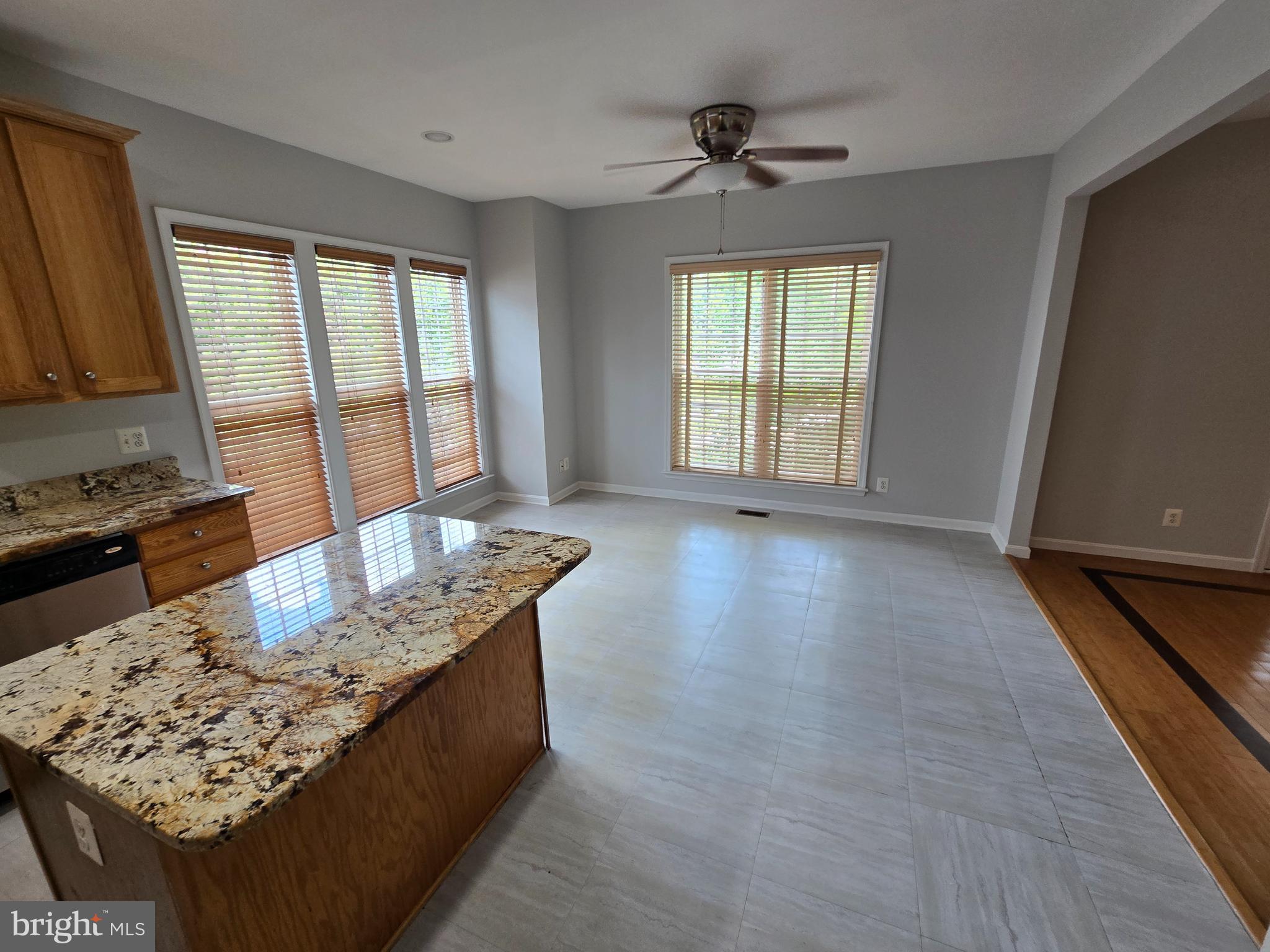 5019 Village Fountain Place Centreville, VA 20120 - Photo 11 of 17 a living room with hard wood floor furniture and a window