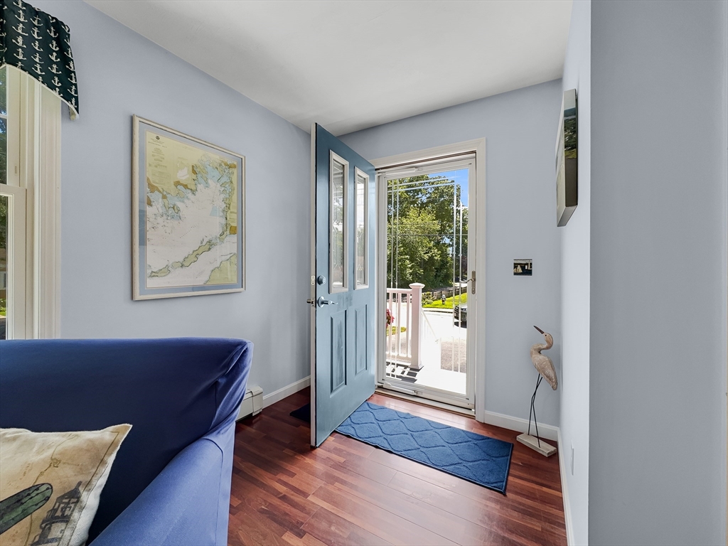 5 Wilson Street Wareham, MA 02571 - Photo 12 of 37 a view of a hallway with wooden floor and windows