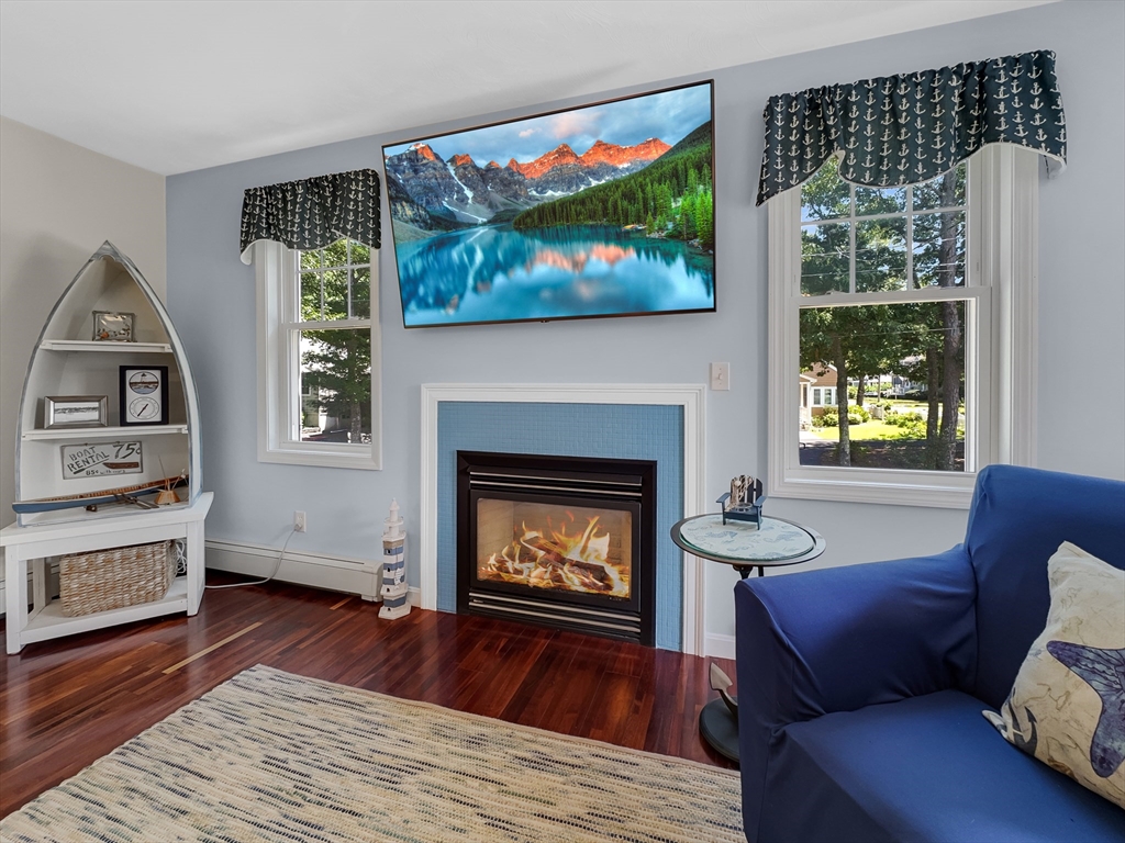 5 Wilson Street Wareham, MA 02571 - Photo 14 of 37 a living room with furniture and a fireplace