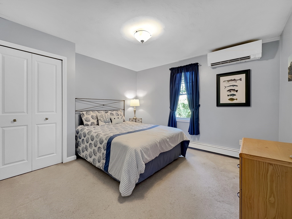 5 Wilson Street Wareham, MA 02571 - Photo 29 of 37 a bedroom with a bed and a night stand