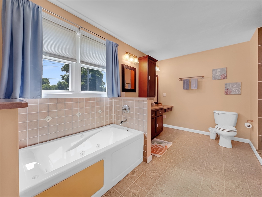 5 Wilson Street Wareham, MA 02571 - Photo 30 of 37 a bathroom with a sink a toilet and bathtub