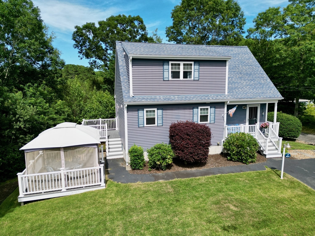 5 Wilson Street Wareham, MA 02571 - Photo 3 of 37 a front view of a house with a garden