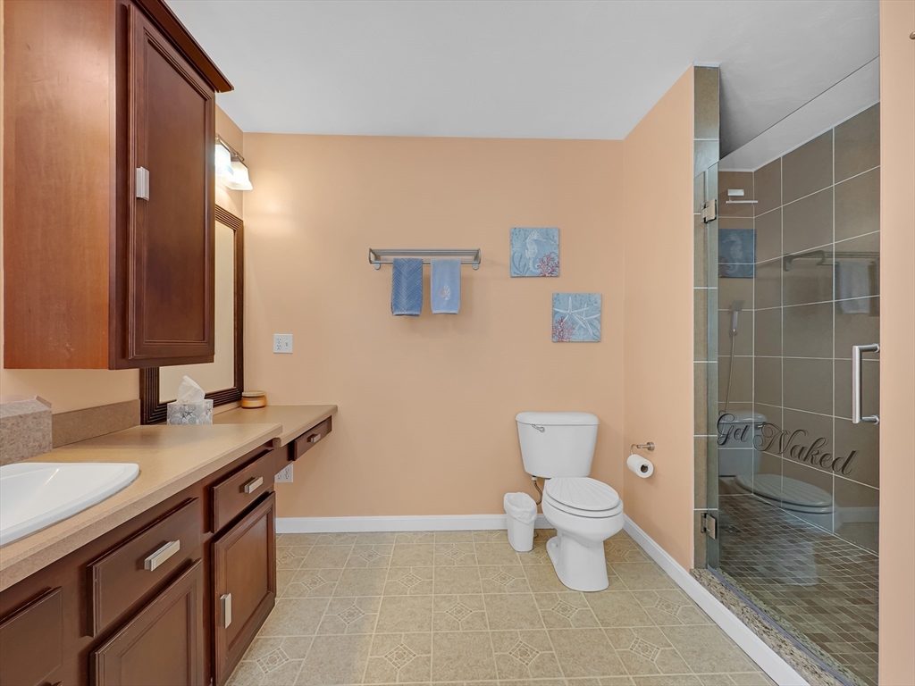 5 Wilson Street Wareham, MA 02571 - Photo 31 of 37 a bathroom with a granite countertop sink a toilet and a mirror