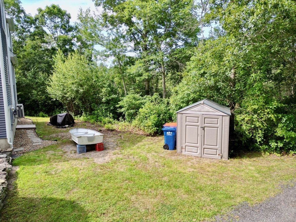 5 Wilson Street Wareham, MA 02571 - Photo 6 of 37 a backyard of a house with table and chairs