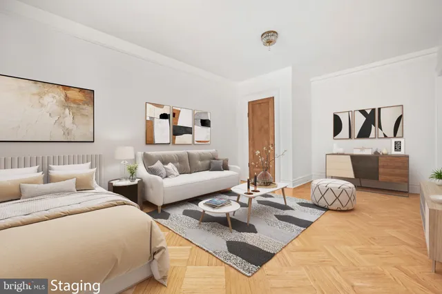 a bedroom with two beds and a large mirror