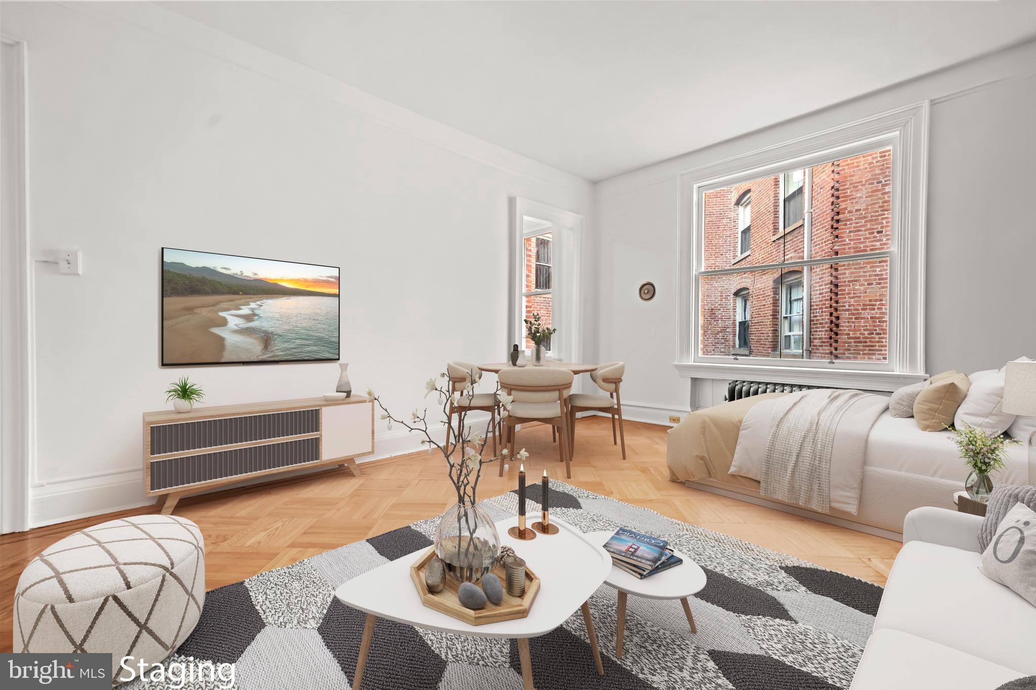 2039 New Hampshire Avenue Northwest, Unit 607 Washington, DC 20009 - Photo 5 of 20 a living room with furniture and wooden floor