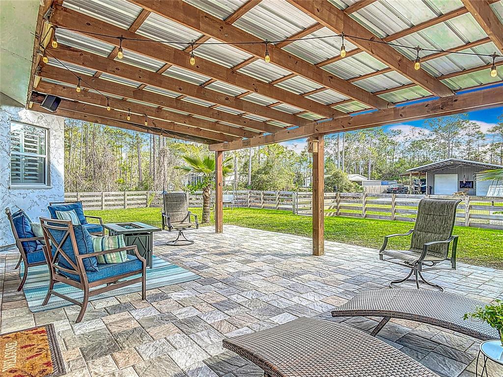 4252 Quail Ranch Road New Smyrna Beach, FL 32168 - Photo 27 of 77 rear patio, view of workshop
