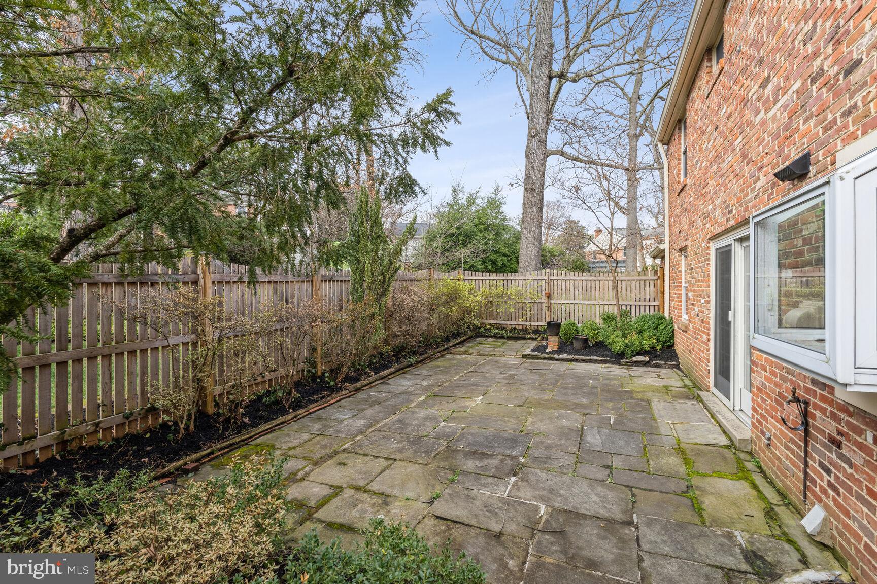 11804 Devilwood Drive Potomac, MD 20854 - Photo 27 of 31 Fenced Patio and an Attached Brick Shed