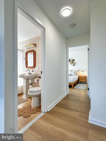 a bathroom view with a sink and mirror