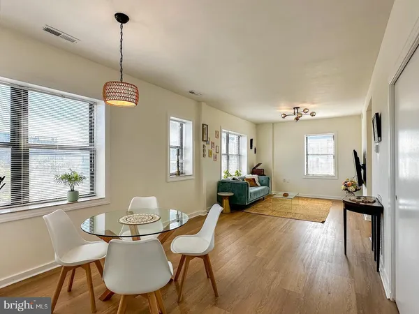 a view of a livingroom with furniture window and wooden floor