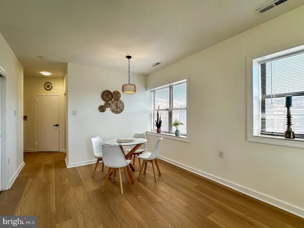 a view of a dining room with furniture and window
