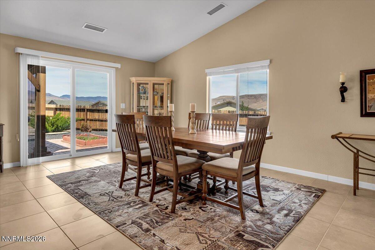 104 Bethpage Road Dayton, NV 89403 - Photo 8 of 65 a dining room with furniture and wooden floor
