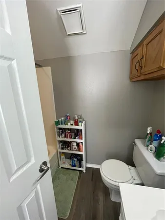 a bathroom with a toilet and a sink