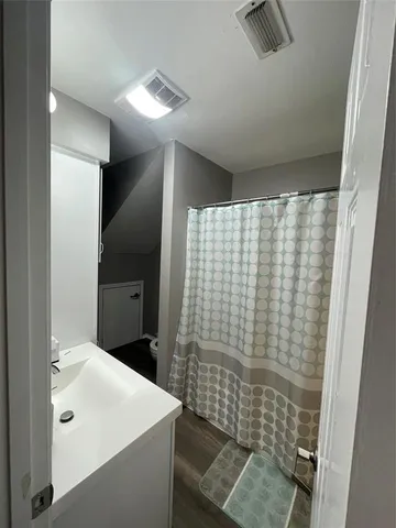 a bathroom with a sink and mirror