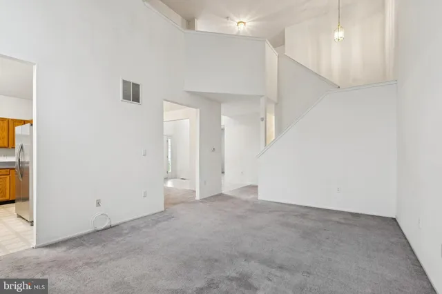 a view of an empty room with a hallway