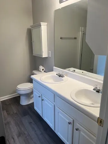 a white bath tub sitting next to a window