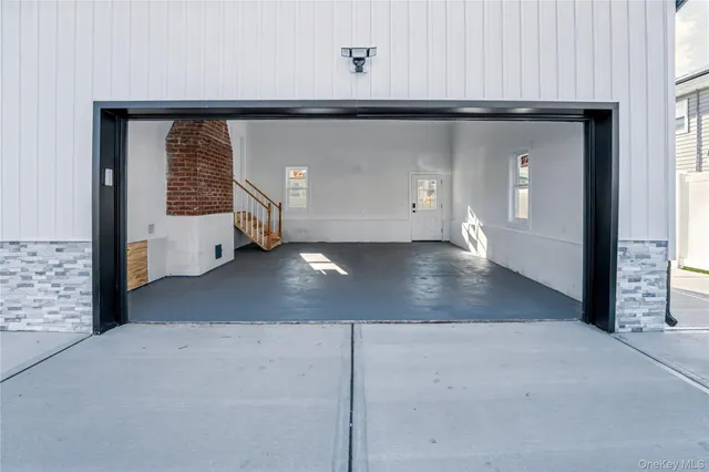 a view of a big room with closet and windows