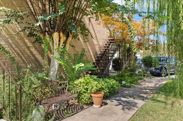 a view of a backyard with sitting area