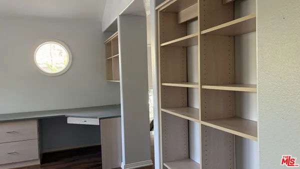 a view of an empty walk in closet