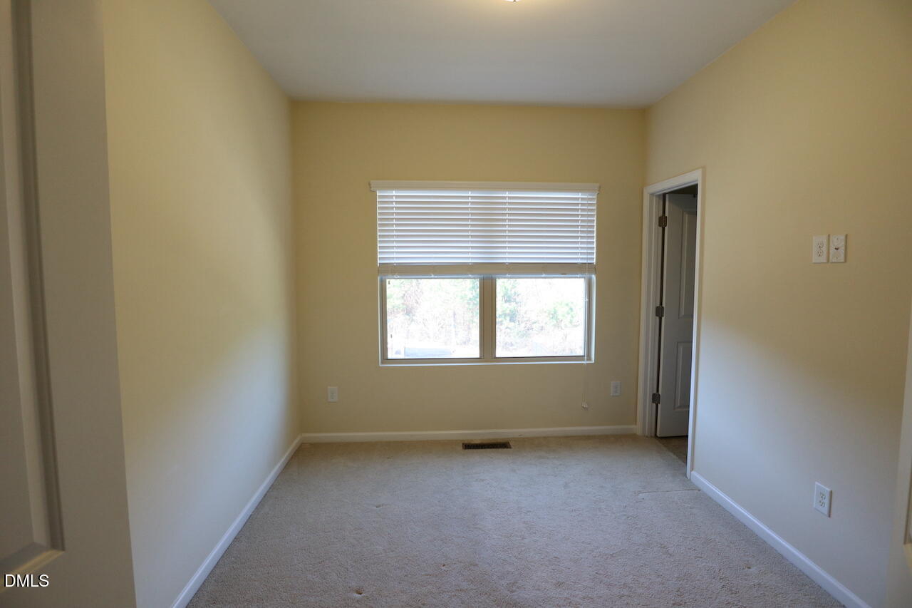 1517 Crafton Way Raleigh, NC 27607 - Photo 18 of 28 an empty room with a window