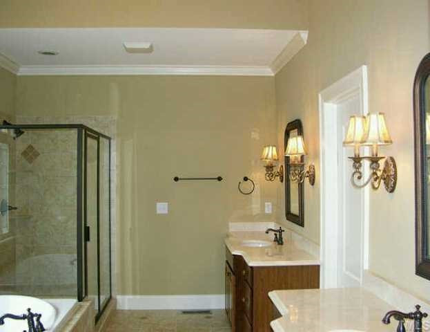 3313 Cotton Road Raleigh, NC 27601 - Photo 4 of 10 Elegant master bath with separate vanities, large tile and glass shower w/dual heads, jetted tub w/in-line heater, and tile flooring. Other