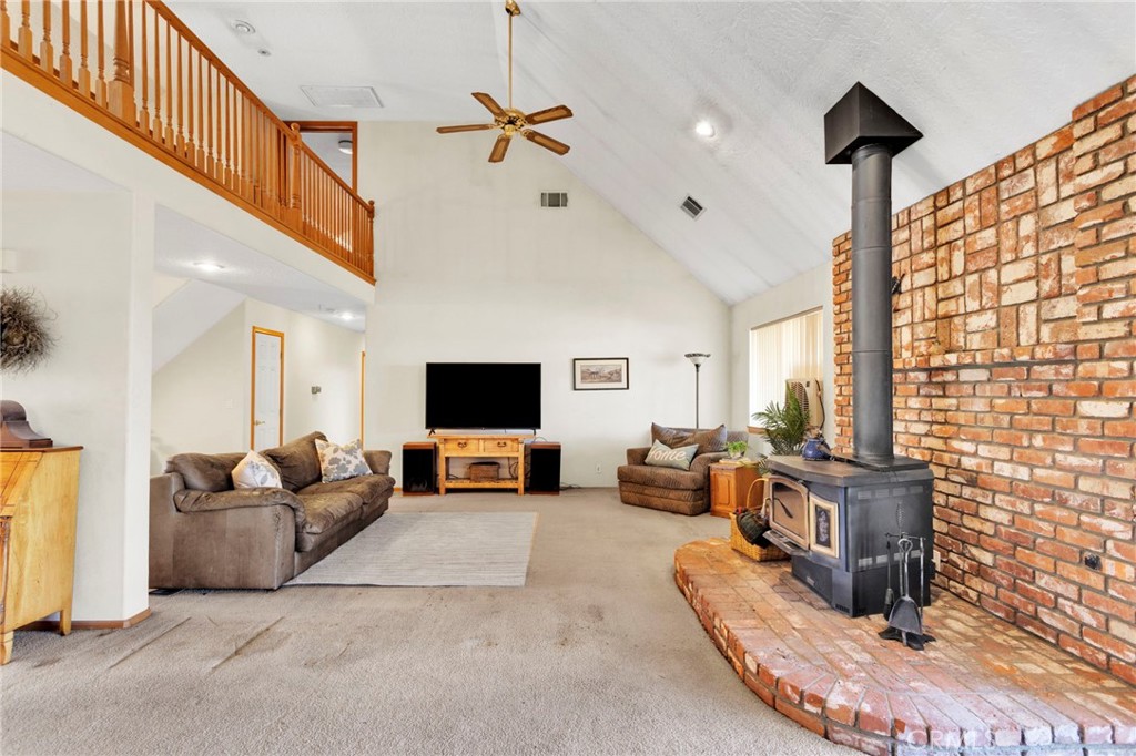 11062 Hollister Road Oak Hills, CA 92344 - Photo 12 of 69 a living room with furniture and a flat screen tv