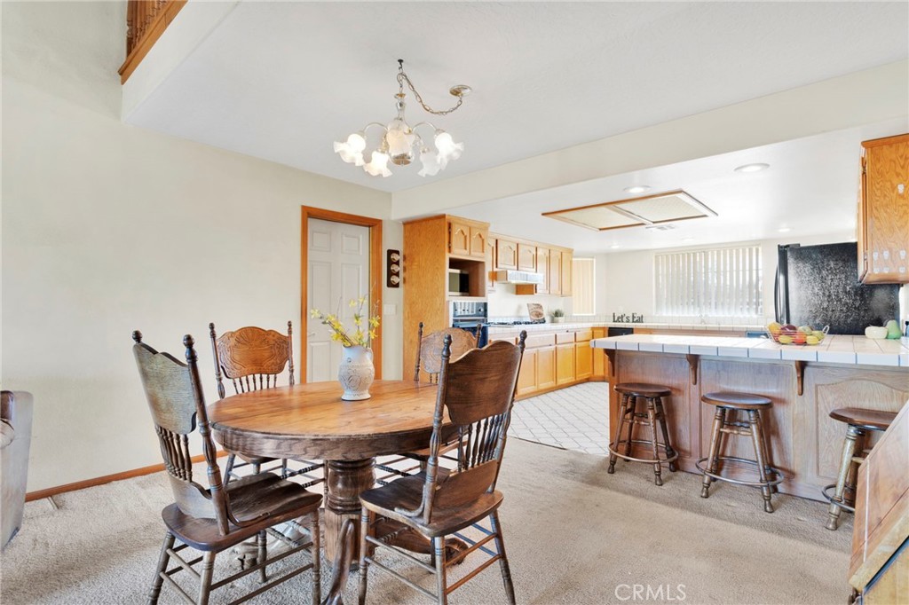 11062 Hollister Road Oak Hills, CA 92344 - Photo 14 of 69 a dining room with furniture and window