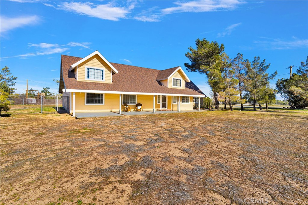 11062 Hollister Road Oak Hills, CA 92344 - Photo 2 of 69 a front view of a house with a yard